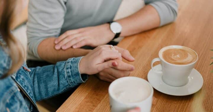 man and woman holding hands