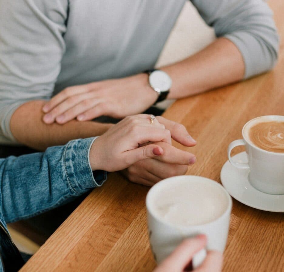 man and woman holding hands